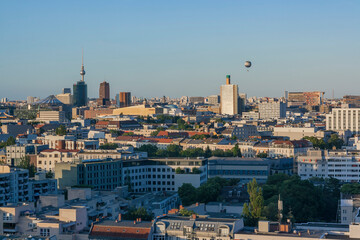 Panoramic aerial view of Berlin cityscape skyline with TV Tower Fernsehturm and hot air balloon at sunset Germany © ufukerb