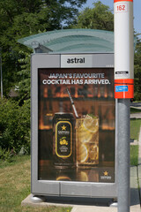 Obraz premium bus shelter with OOH advertising poster for Sapporo Vodka Lemon Sour with bus stop of TTC #162 Lawrence-Donway, Toronto