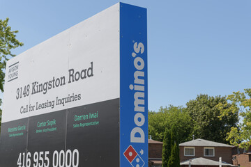 Obraz premium large real estate sign at 3148 Kingston Rd (Domino's pizza sign) at Rockwood Plaza, Scarborough, Toronto