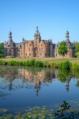 Obraz premium Ooidonk Castle / Kasteel van Ooidonk, 16th century Flemish Renaissance moated castle at Sint-Maria-Leerne in summer, Deinze, East Flanders, Belgium