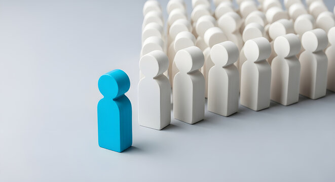Blue leader figure standing out from crowd of identical white figurines representing unique talent management business leadership corporate hierarchy growth