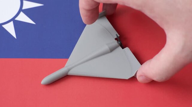 A Shahed drone featuring a prohibition symbol on the taiwanese flag as a conceptual background