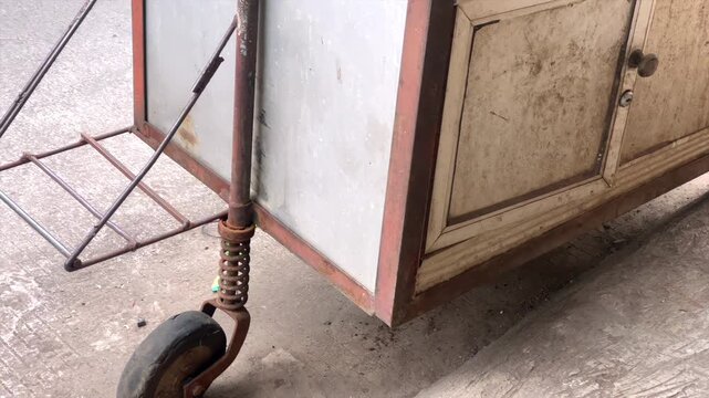 Abandoned and broken food cart in street
