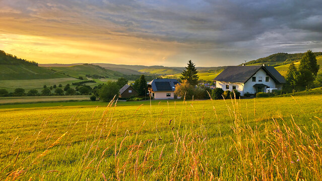 Sunset view over the beautiful rolling fields and vineyards of the Mosel region of Germany during summer