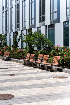 Wooden bench chairs in Williamsburg, Brooklyn waterfront park along the East River