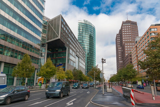 Street view of Potsdamer Platz financial district with BahnTower and Kollhoff Tower skyscrapers and city traffic