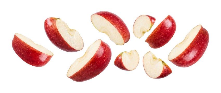 Falling sliced red apple pieces isolated on transparent background