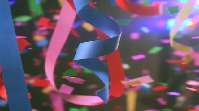 Colorful streamers and confetti fill the air, creating a festive atmosphere full of joy and celebration.