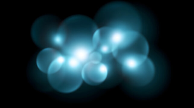 Abstract blue light bokeh creates a dreamy atmosphere, ideal for artistic backgrounds and designs.