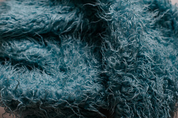 Blue fluffy fabric texture close up with curly fibers © Alena Vilgelm