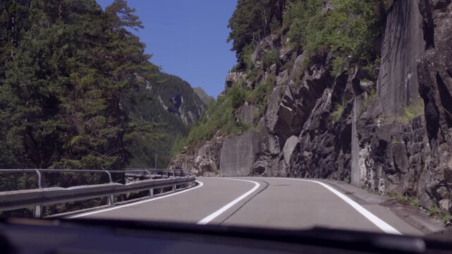 POV of Driving a Sports Car Through the Curves of a Mountain Pass. Susten Pass, Switzerland