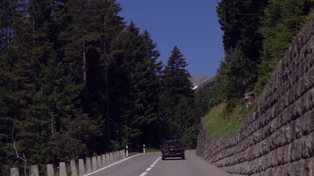 POV of Driving a Sports Car Through the Curves of a Mountain Pass. Susten Pass, Switzerland