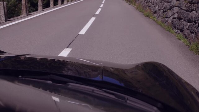 POV of Driving a Sports Car Through the Curves of a Mountain Pass. Susten Pass, Switzerland