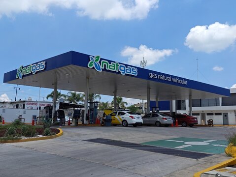 ZAPOPAN, MEXICO - JULY 25, 2026: Natgas natural gas station with cars refueling at pumps.