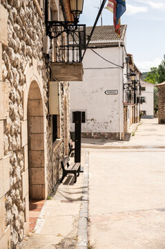 Guadalaviar, Teruel village street with stone houses and street sign