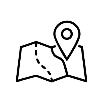 Folded paper map with location pin marker for travel planning navigation.
