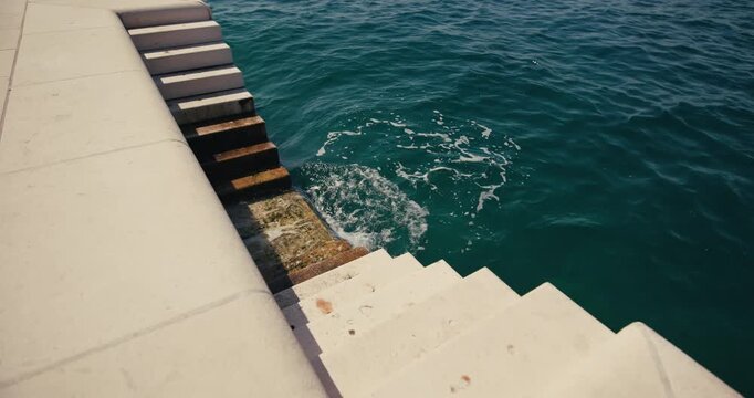  Stone steps lead from the waterfront promenade into the Adriatic Sea in Zadar.