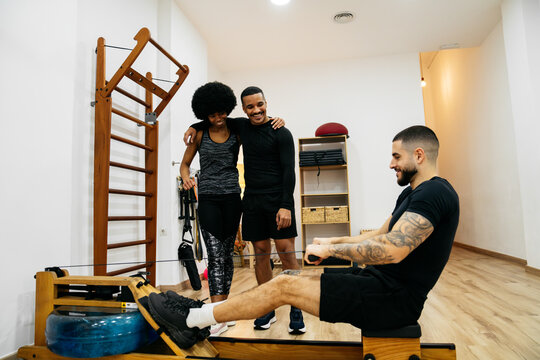 Friends working out together in the gym environment