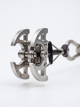 Metal climbing camming device for rock climbing with climbing gear, climbing cam