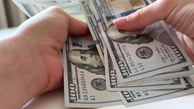 dollars sort, count, spread and display a stack of one hundred dollar bills on a clean white background. A versatile finance concept for savings, wealth, investment, budgeting and cash transactions.