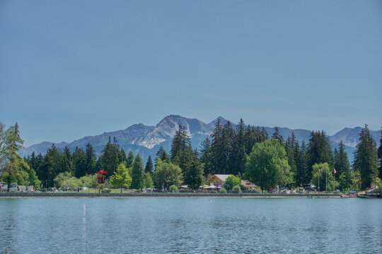 Crans montana lake, switzerland, with mountains and forest during summer