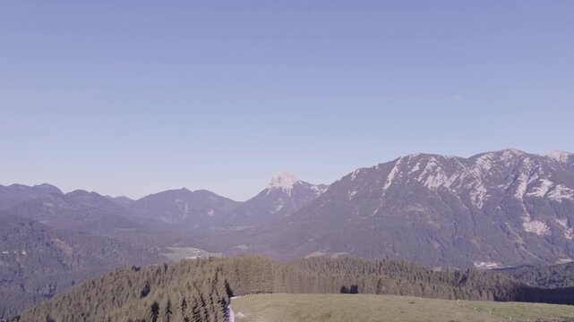 Aerial View of Alpine Farmhouses Framed by a Dramatic Mountain Range. Achenkirch, Austria