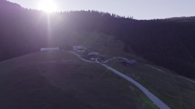 Aerial View of Alpine Farmhouses Framed by a Dramatic Mountain Range. Achenkirch, Austria