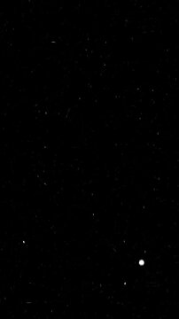 Distressed celluloid film overlay with authentic vintage scratches, floating debris, subtle light leaks, flickering grain animation, seamless cinematic, phone screen black background. 4k video