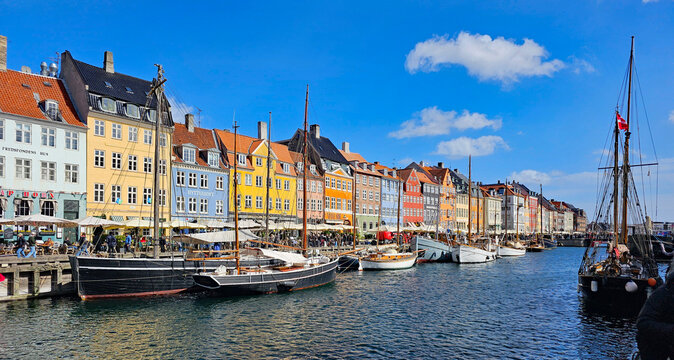 Wonderful views of Copenhagen, Denmark, with colorful houses and sculptures in beautiful weather