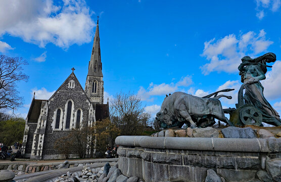 Wonderful views of Copenhagen, Denmark, with colorful houses and sculptures in beautiful weather