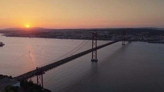 Panoramic aerial view of the 25 de Abril suspension bridge crossing the Tagus River toward Lisbon