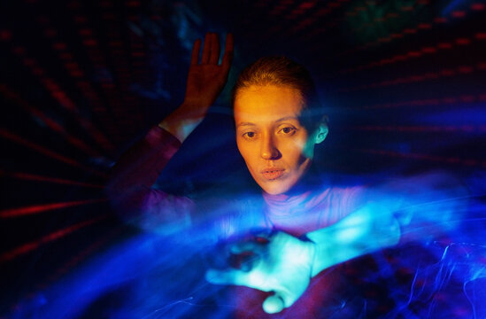 Portrait with neon light trails suggesting virtual reality