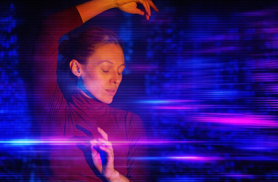 Woman immersed in virtual reality neon light motion effect