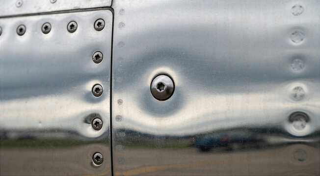 Polished Metal Aircraft Fuselage Skin Panel With Rivets
