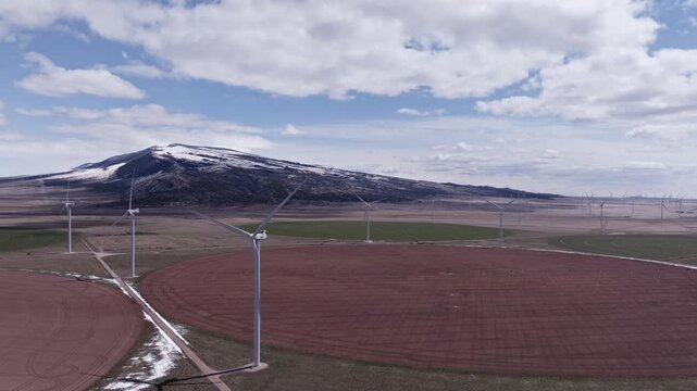 Aerial View of a Wind Farm Amid Farmland on the Rural Plains of Bridger, Montana
