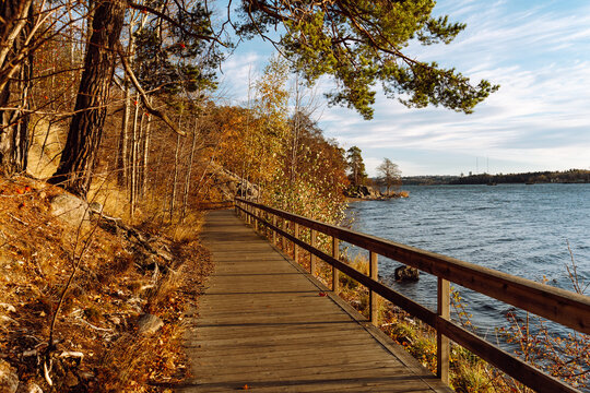Wooden boardwalk by Lilla Vartan shore in Lidingo
