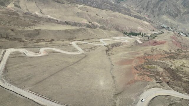 Chuckurchak, Kyrgyzstan December 16, 2025: Picturesque village with mountains natural beauty in Central Asia.