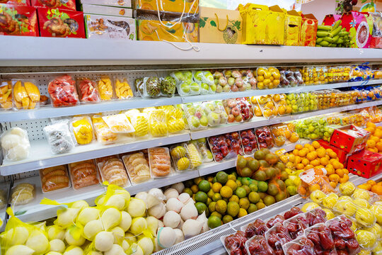 Fresh tropical fruit display in a Vietnam supermarket aisle
