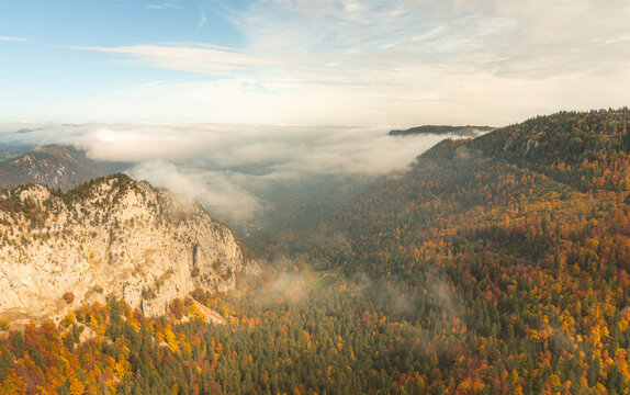 Colourful autumn mountain landscape with misty valley view