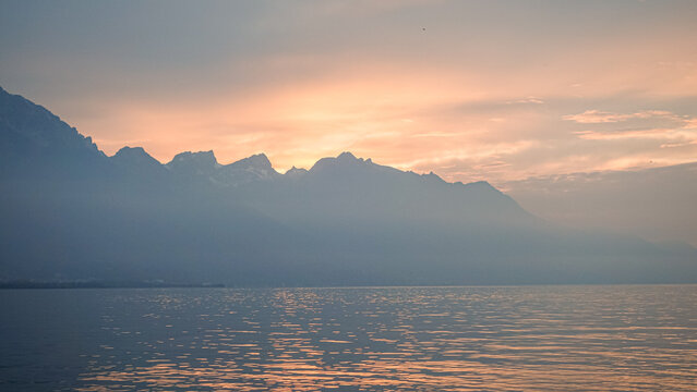 Colorful autumn sunrise over mountain lake landscape