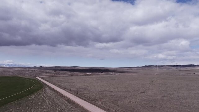 Aerial View of a Wind Farm Amid Farmland on the Rural Plains of Bridger, Montana