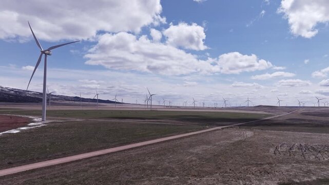 Aerial View of a Wind Farm Amid Farmland on the Rural Plains of Bridger, Montana