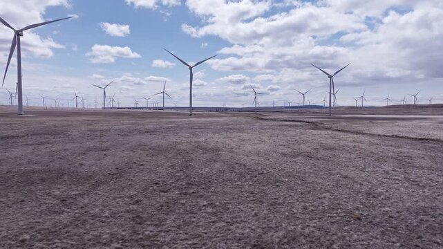 Aerial View of a Wind Farm Amid Farmland on the Rural Plains of Bridger, Montana