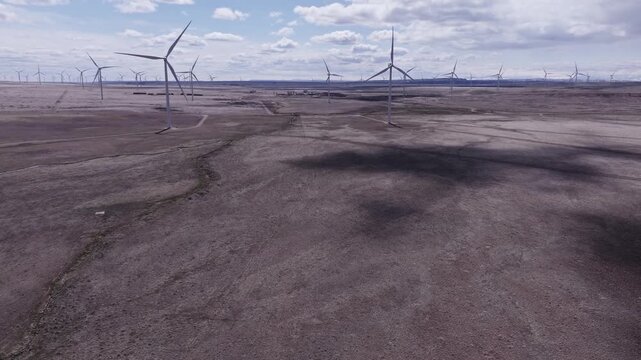 Aerial View of a Wind Farm Amid Farmland on the Rural Plains of Bridger, Montana