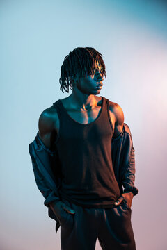 African man in tank top with dramatic colored lighting