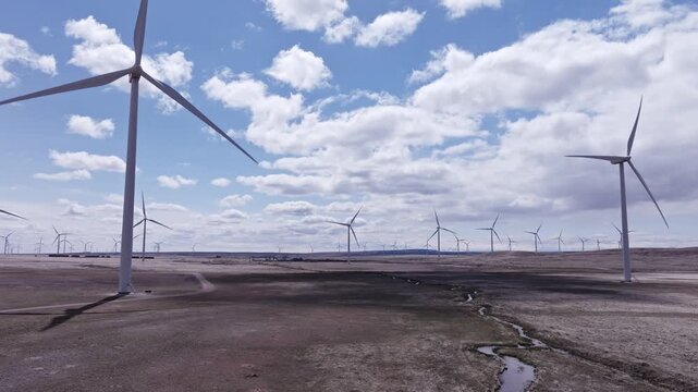 Aerial View of a Wind Farm Amid Farmland on the Rural Plains of Bridger, Montana