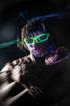 African man in neon glasses with motion blur portrait