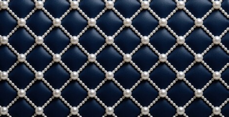 Fototapeta premium Luxury pattern of white pearls arranged in diamond grid on dark blue leather background. Elegant textile texture features bead strings forming geometric shapes. Sophisticated material design creates