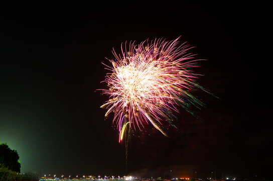 Long exposure photo captures exploding fireworks on a beach in Perth, Western Australia.