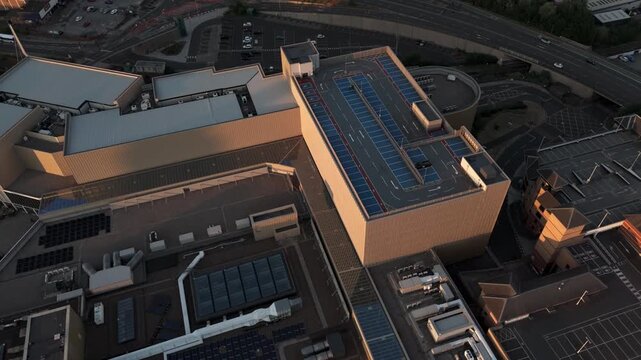 Aerial fly forward over The Glass Works rooftop car park in Barnsley, UK